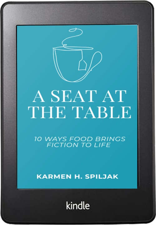 Kindle book, teal background, a drawing of a teacup with a tea bag. Title; A seat at the table; 10 ways food brings fiction to life author: Karmen H. Spiljak