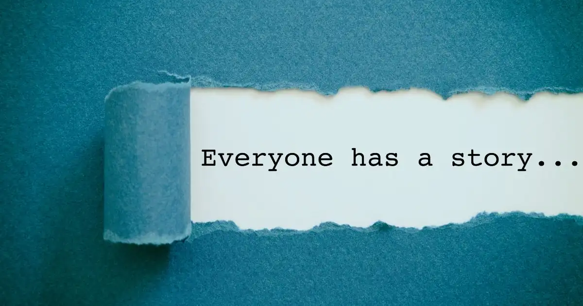 Teal paper torn in the middle, revealing 'everyone has a story' written on a white background
