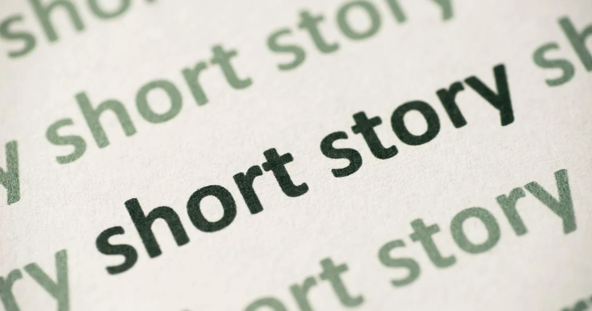 The word ‘Short story’ typed on a white paper many times in green letters and once in black, in the middle